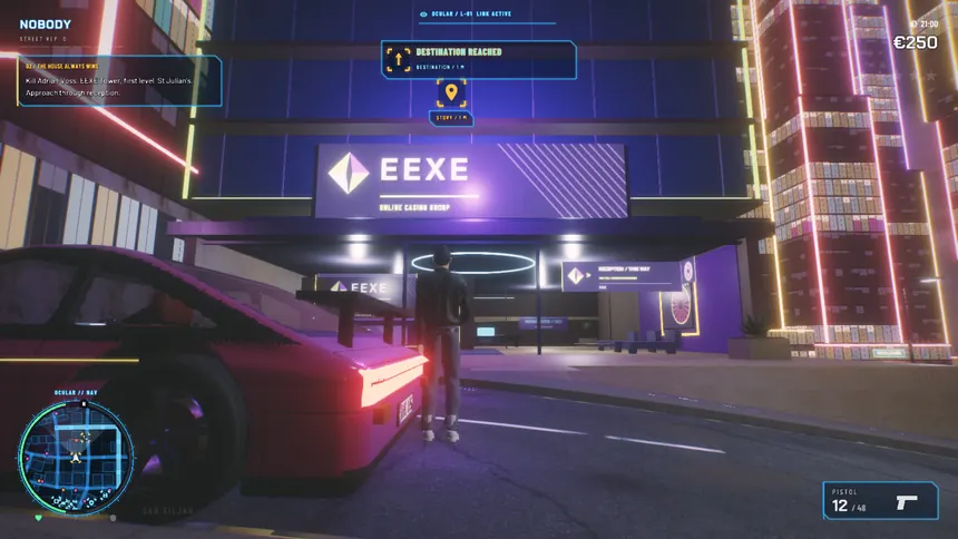 The EEXE casino tower at night with a sports car