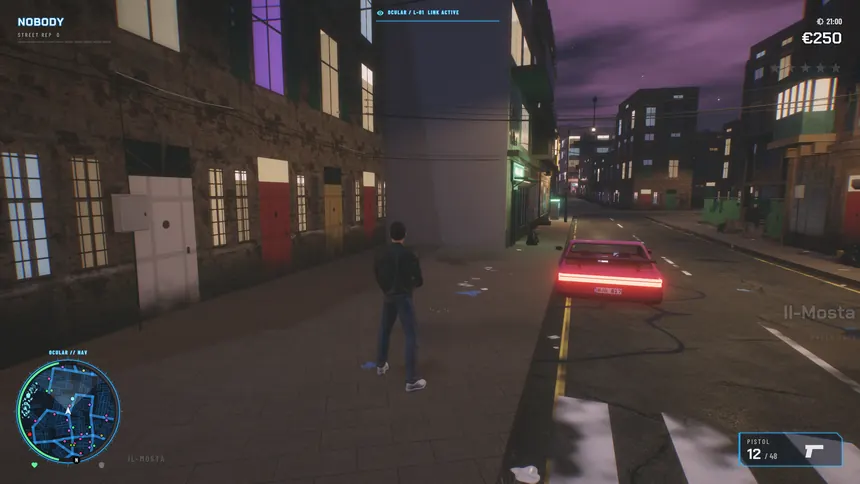 Matthew on a night street with a car's tail lights